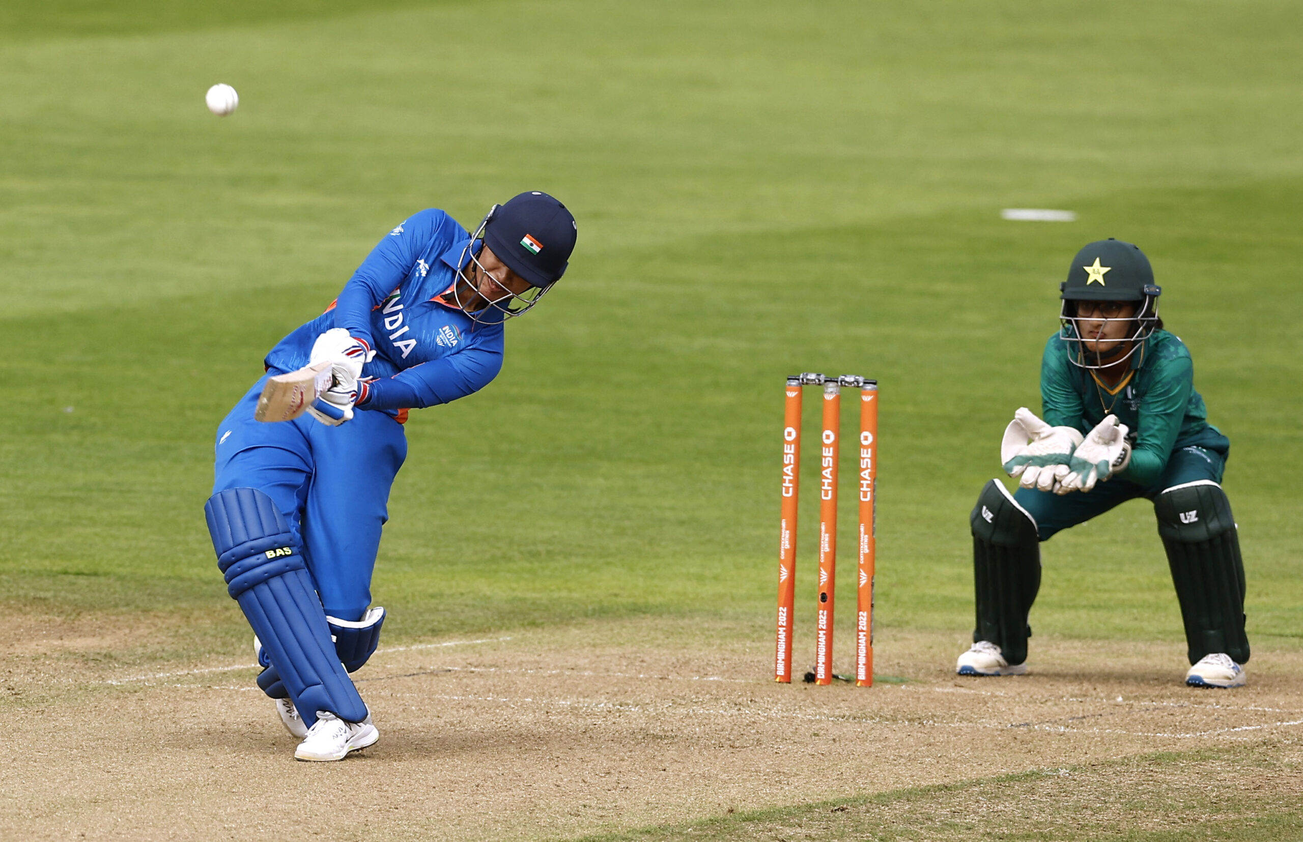 Commonwealth Games - Women's Cricket T20 - Group A - Pakistan v India - Edgbaston Stadium, Birmingham, Britain  - July 31, 2022 India's Smriti Mandhana hits six runs to reach her half a century REUTERS/Jason Cairnduff