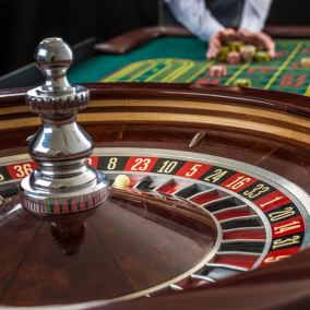 Betbhai9 roulette wheel with ball and betting layout